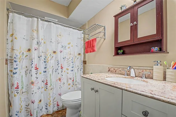 a bathroom with a sink and a toilet