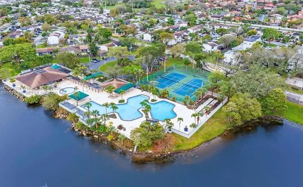 an aerial view of a house with a lake view