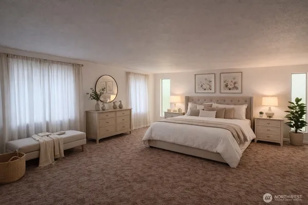 a spacious bedroom with a bed a couch and dresser