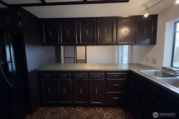 a view of a dining room with furniture and chandelier