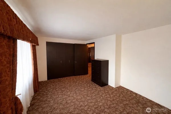 a living room with furniture and flat screen tv