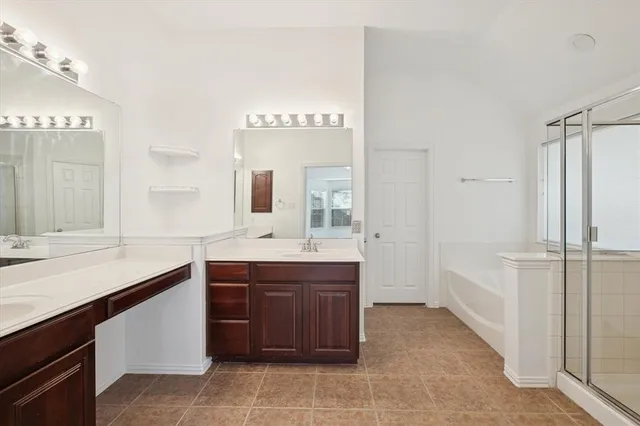 a spacious bathroom with a granite countertop sink mirror and a