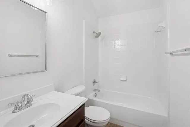 a bathroom with a sink toilet and a bathtub