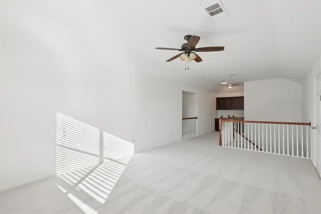a view of room and stairs with wooden floor