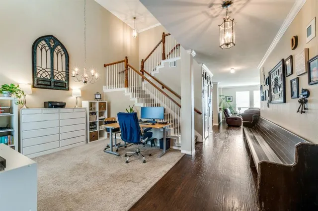 a view of entryway and hall with wooden floor
