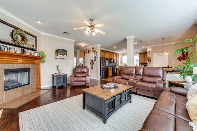 a living room with furniture and a fireplace