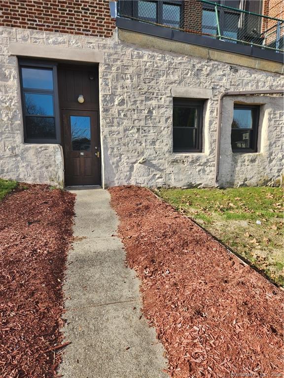 120 Elizabeth Street, Unit L1 Norwich, CT 06360 - Photo 1 of 1 a view of front door of house with yard