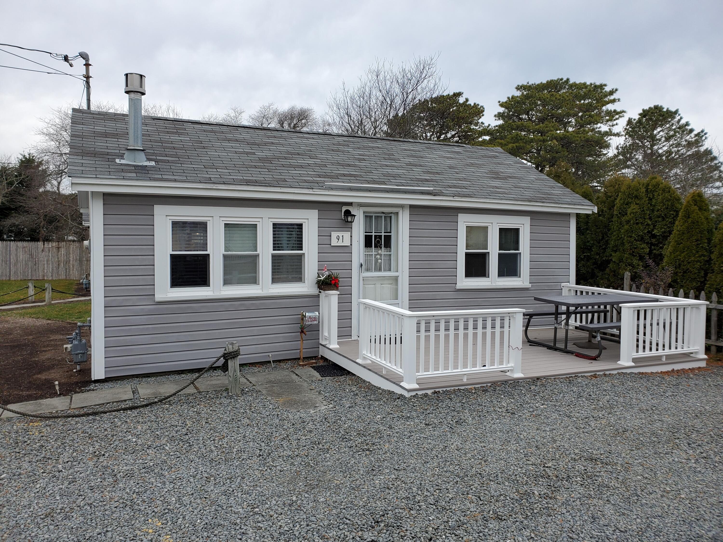 91 Glendon Road, Unit 91 Dennis Port, MA 02639 - Photo 1 of 11 a view of a house with a yard
