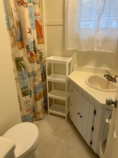 91 Glendon Road, Unit 91 Dennis Port, MA 02639 - Photo 11 of 11 a bathroom with a sink a toilet and shower