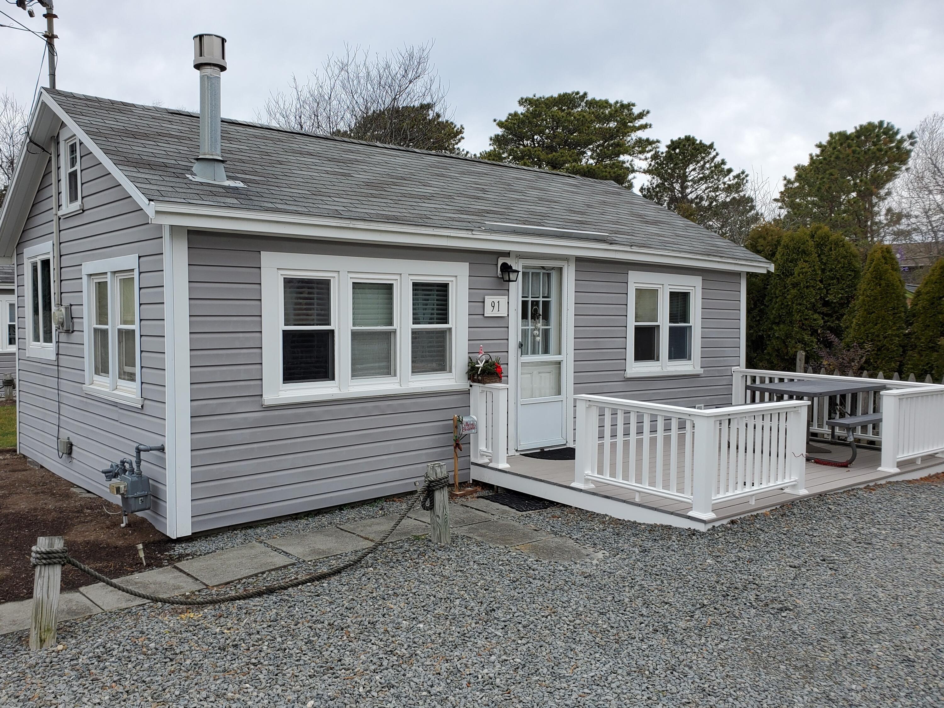 91 Glendon Road, Unit 91 Dennis Port, MA 02639 - Photo 2 of 11 a view of a house with a yard