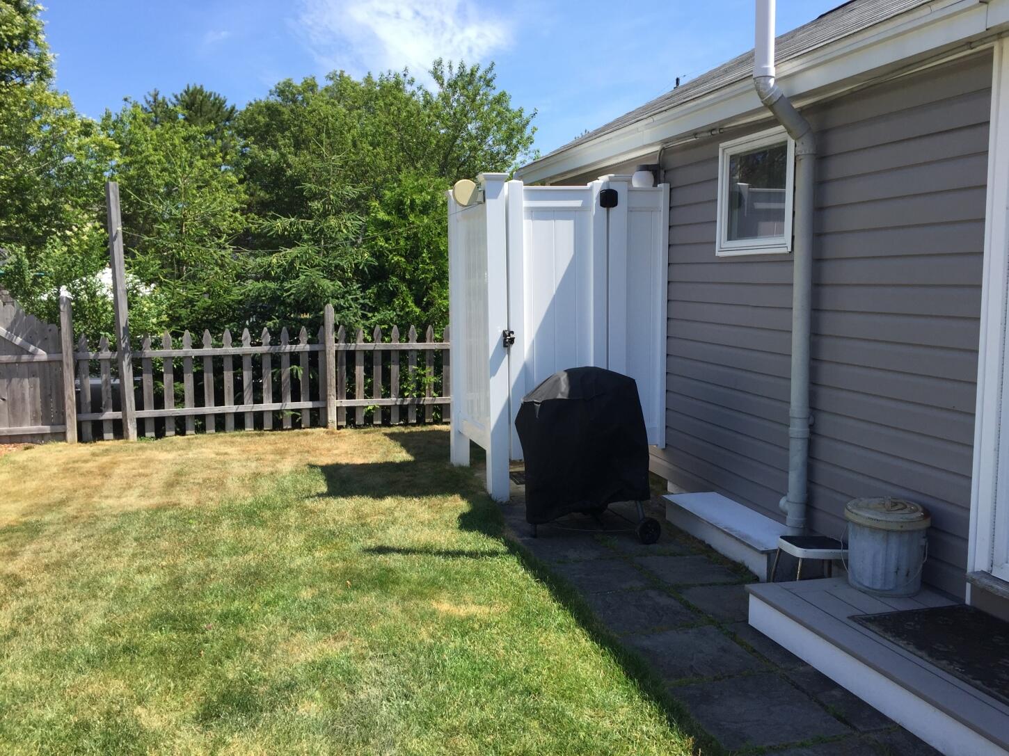 91 Glendon Road, Unit 91 Dennis Port, MA 02639 - Photo 3 of 11 a view of a back yard of the house