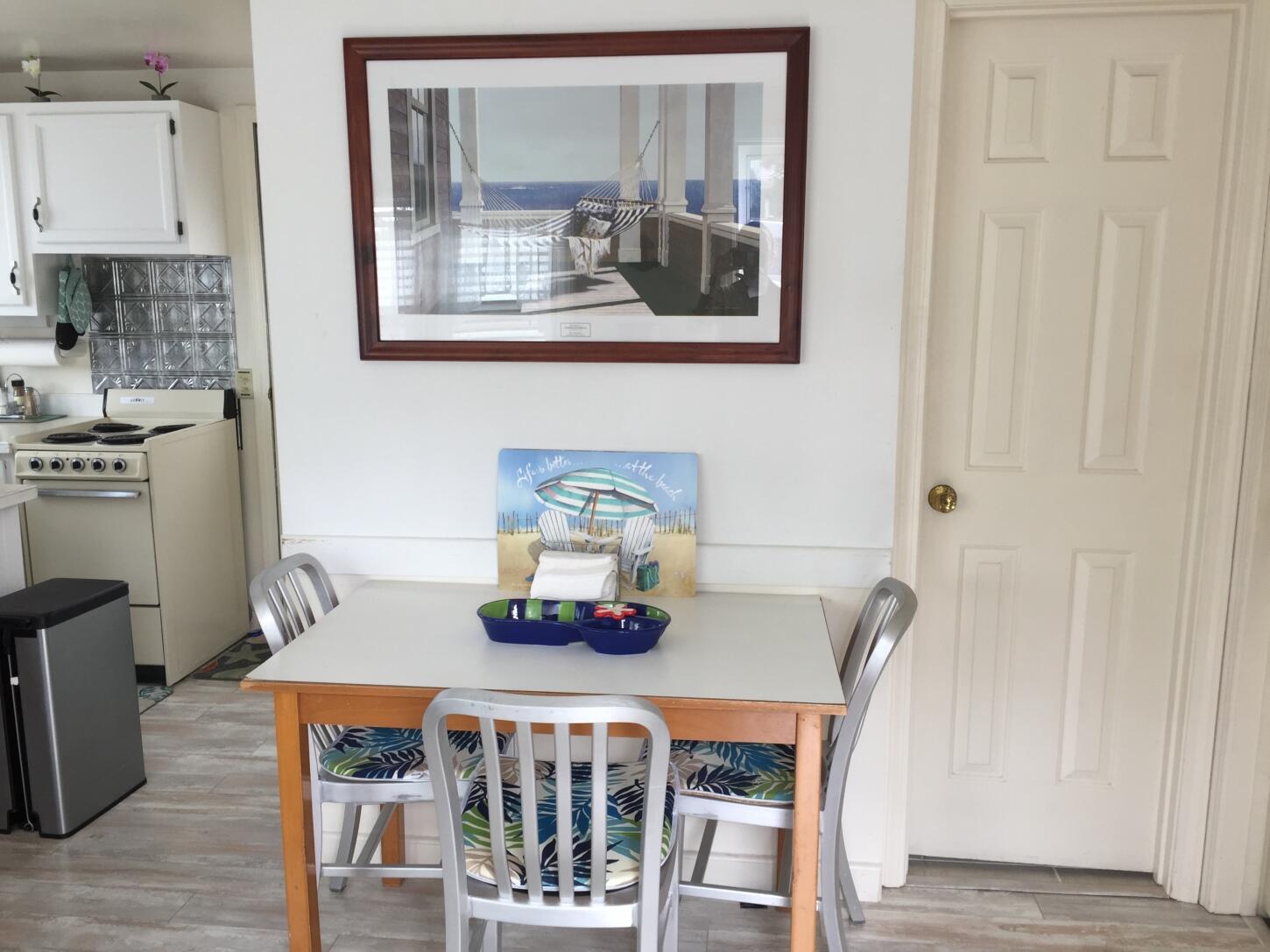 91 Glendon Road, Unit 91 Dennis Port, MA 02639 - Photo 7 of 11 a dining room with furniture and window