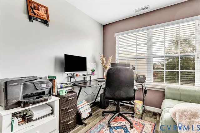 a bedroom with a bed and a desk