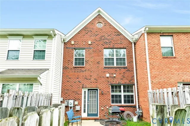 a backyard of a house with seating space