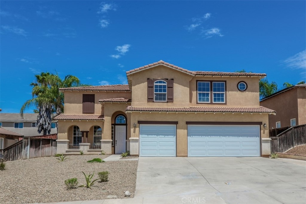 28720 Tupelo Road Menifee, CA 92584 - Photo 1 of 1 a front view of a house with garden