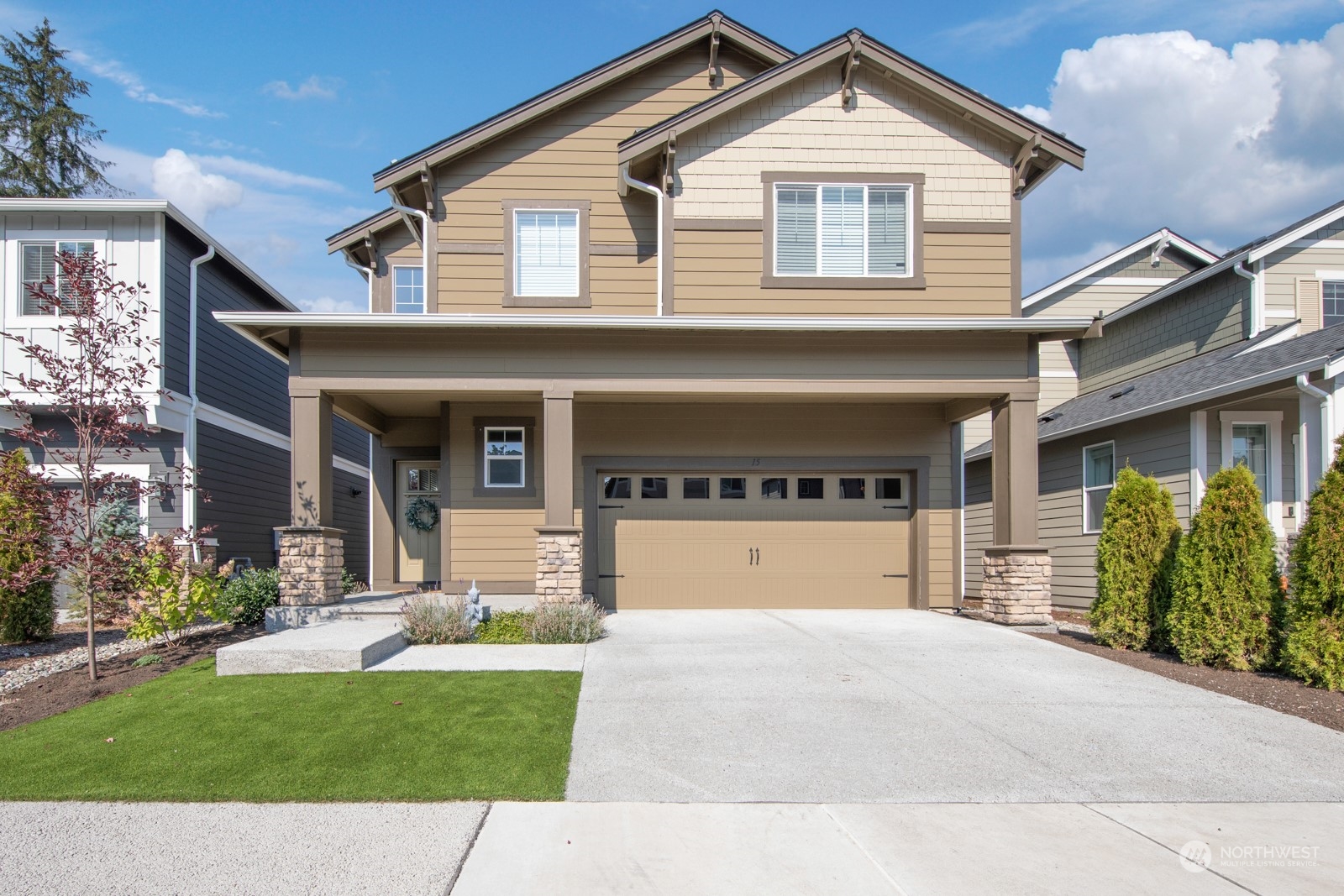 15 182nd Street Southeast Bothell, WA 98012 - Photo 1 of 32 a front view of a house with a yard and garage
