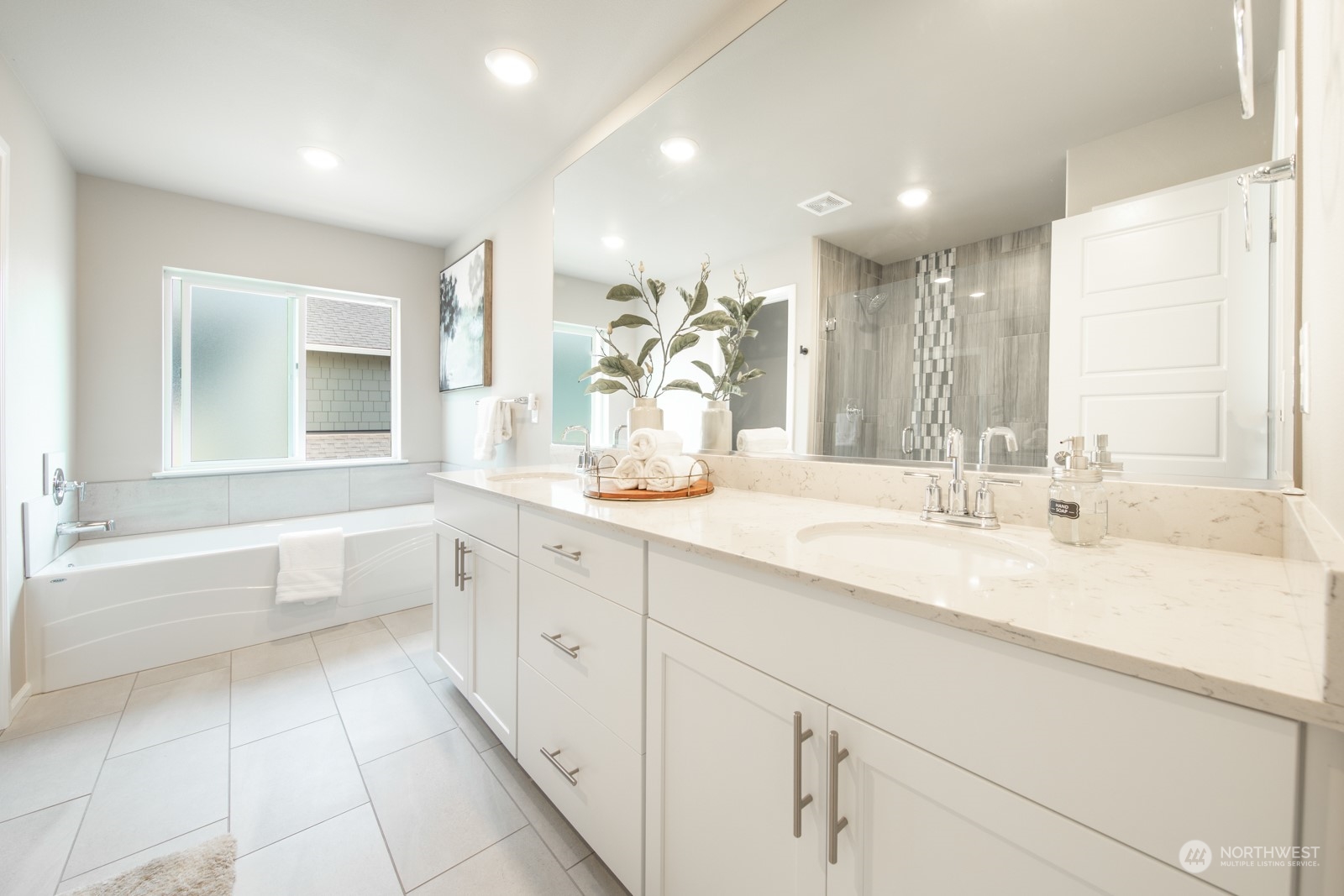 15 182nd Street Southeast Bothell, WA 98012 - Photo 20 of 32 a bathroom with a tub sink and mirror