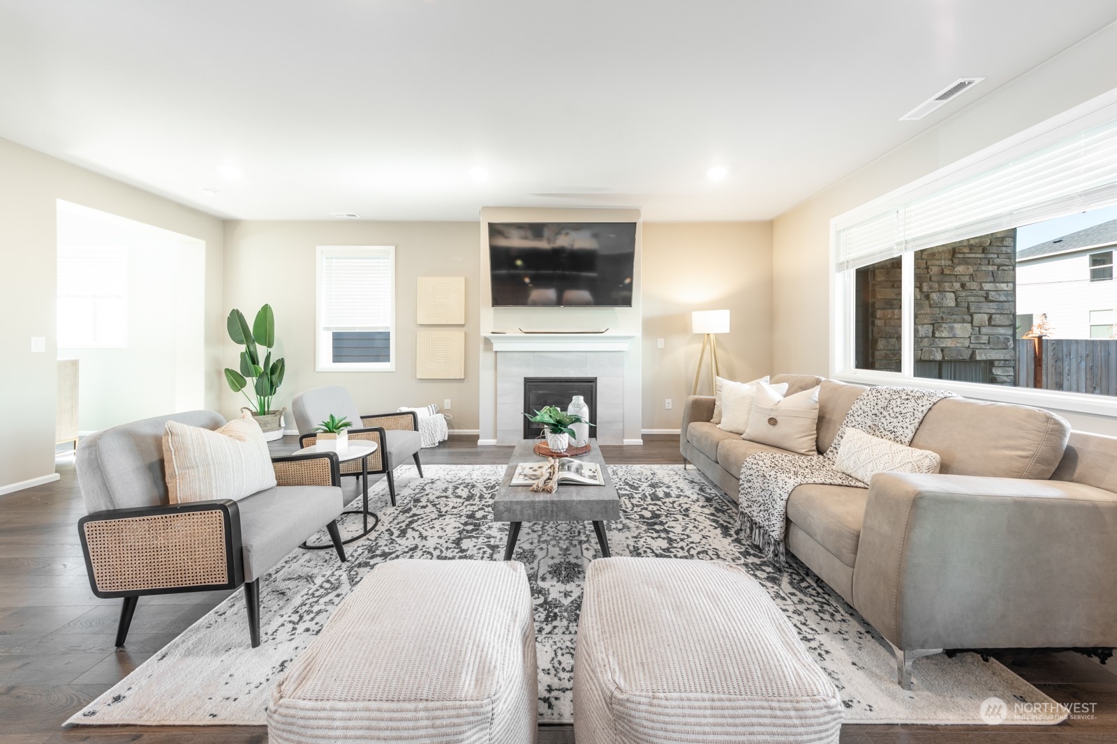 15 182nd Street Southeast Bothell, WA 98012 - Photo 2 of 32 a living room with furniture a flat screen tv and a fireplace