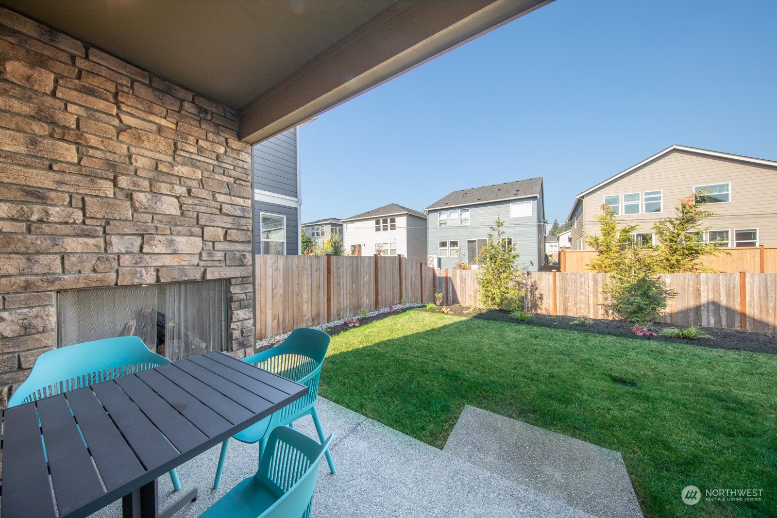 15 182nd Street Southeast Bothell, WA 98012 - Photo 28 of 32 a view of a patio with a table and chairs