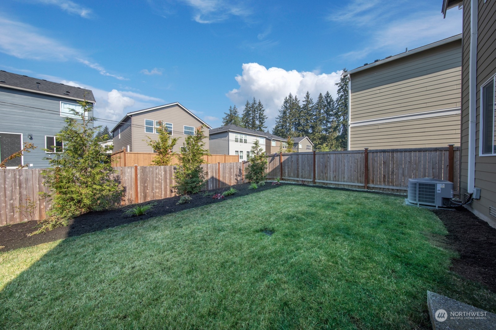 15 182nd Street Southeast Bothell, WA 98012 - Photo 29 of 32 a view of a house with backyard and a tree