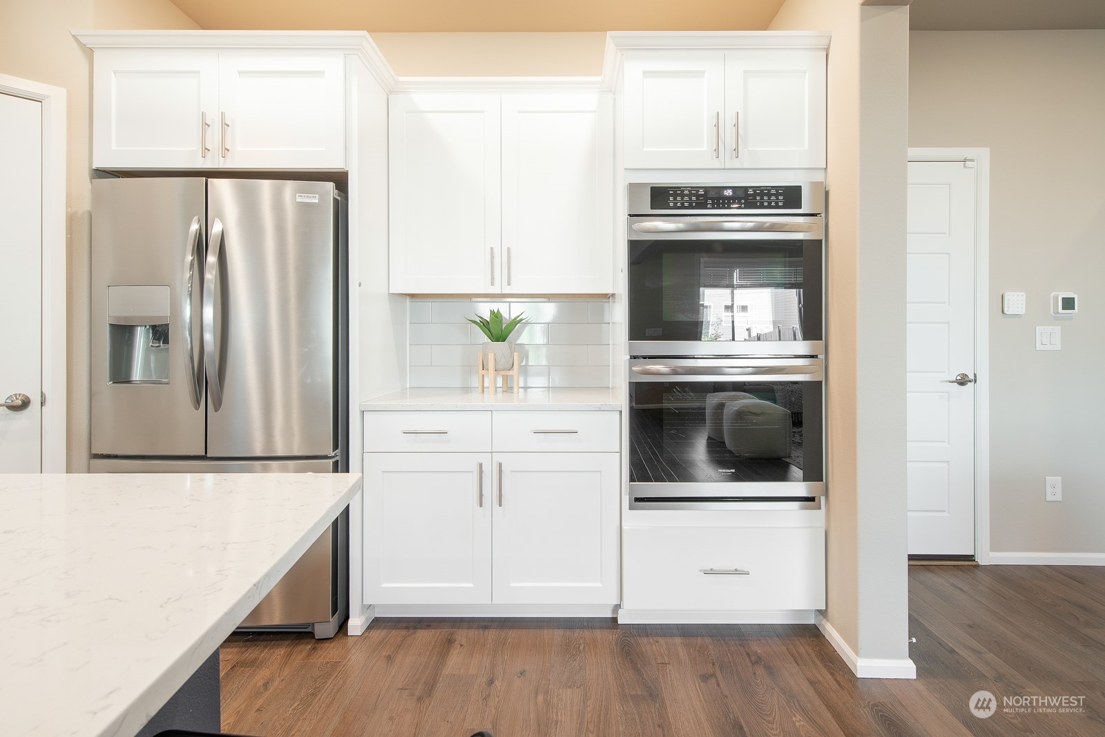 15 182nd Street Southeast Bothell, WA 98012 - Photo 9 of 32 a kitchen with a refrigerator and a stove