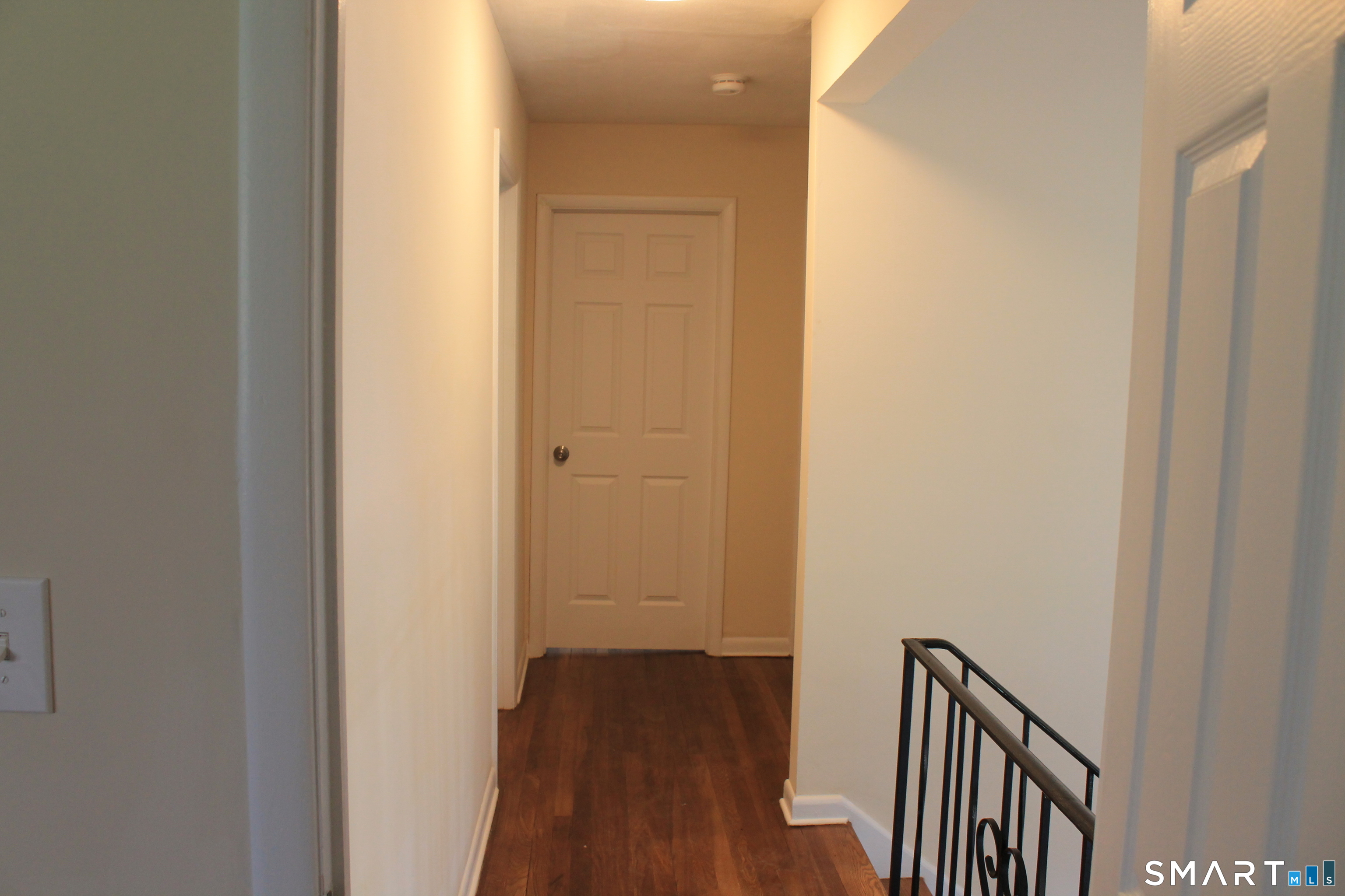 134 Sunset Street Windsor Locks, CT 06096 - Photo 18 of 23 a view of a hallway with wooden floor