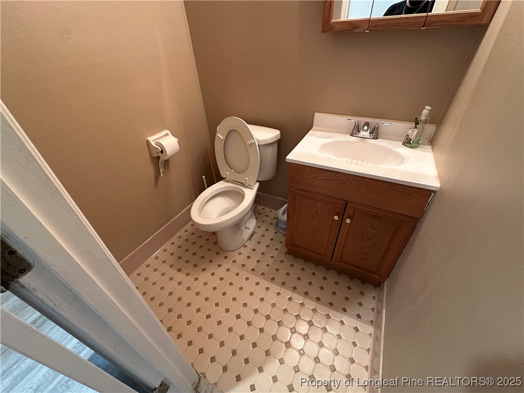 3120 Hampstead Road Lumberton, NC 28360 - Photo 21 of 30 a bathroom with a sink and a toilet