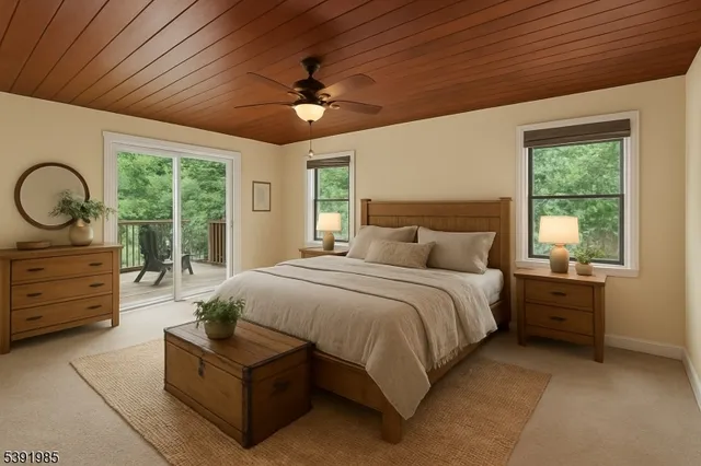 a spacious bedroom with a bed and a chandelier