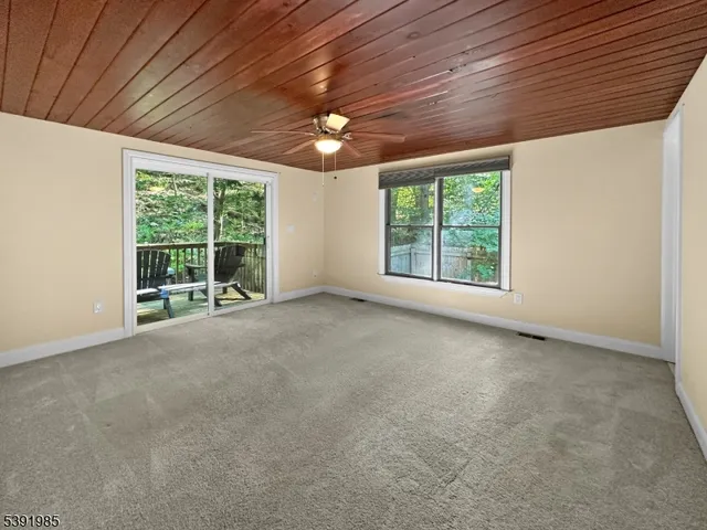 a view of a room with a large window