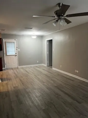 a view of an empty room with a window