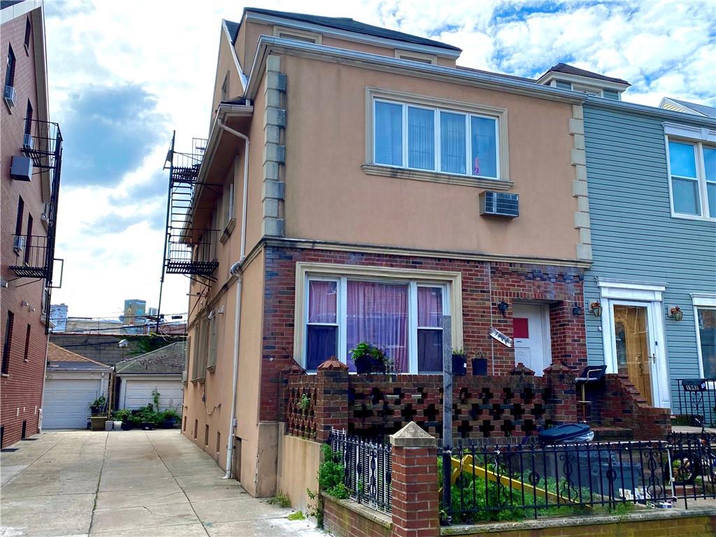 1944 85th Street Brooklyn, NY 11214 - Photo 1 of 10 a front view of a house with patio