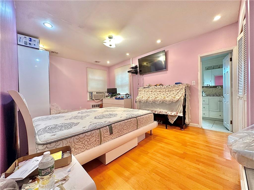 1944 85th Street Brooklyn, NY 11214 - Photo 5 of 10 a bed room with a bed