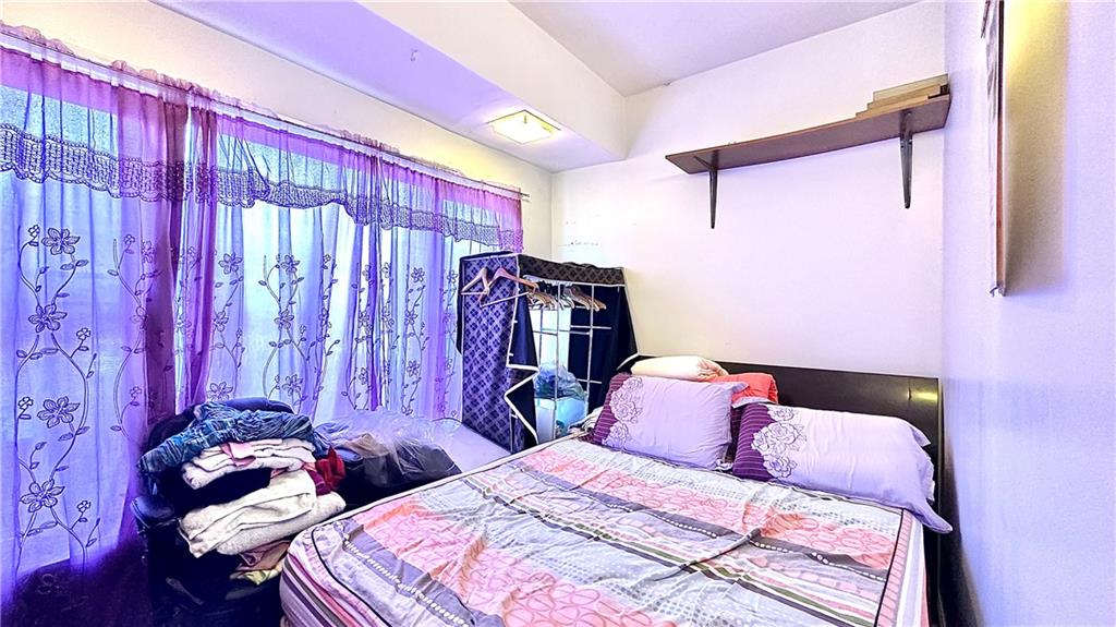 1944 85th Street Brooklyn, NY 11214 - Photo 8 of 10 a bedroom with two bed and a window