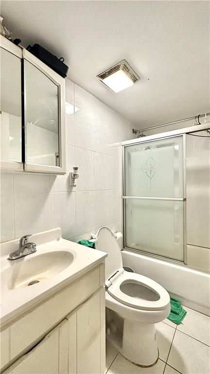 1944 85th Street Brooklyn, NY 11214 - Photo 10 of 10 a bathroom with a sink a toilet and shower