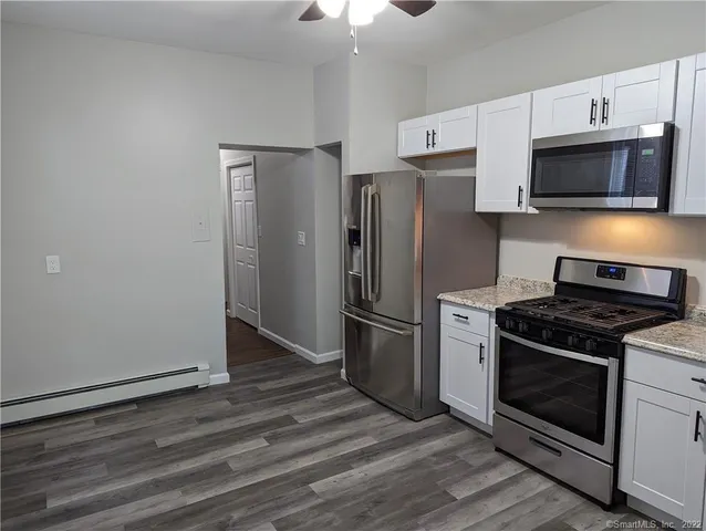 a kitchen with a stove microwave and refrigerator