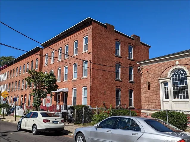 a view of a car parked in front of a building
