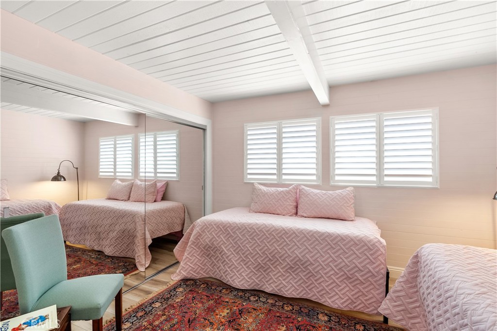 5 Canal Circle Newport Beach, CA 92663 - Photo 15 of 22 a bedroom with two beds and windows