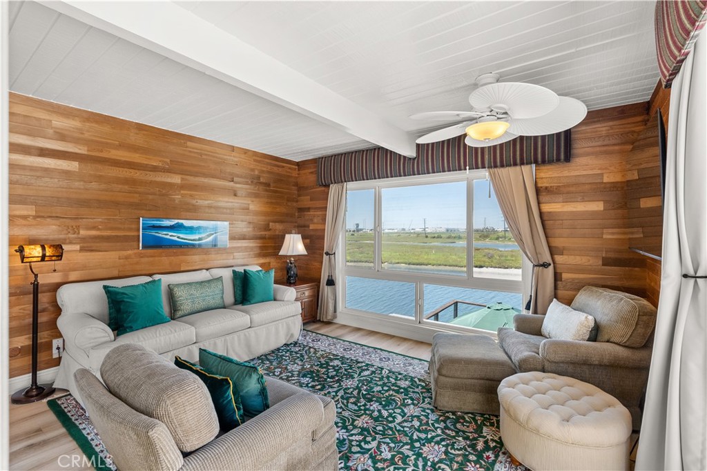 5 Canal Circle Newport Beach, CA 92663 - Photo 16 of 22 a living room with furniture and a large window
