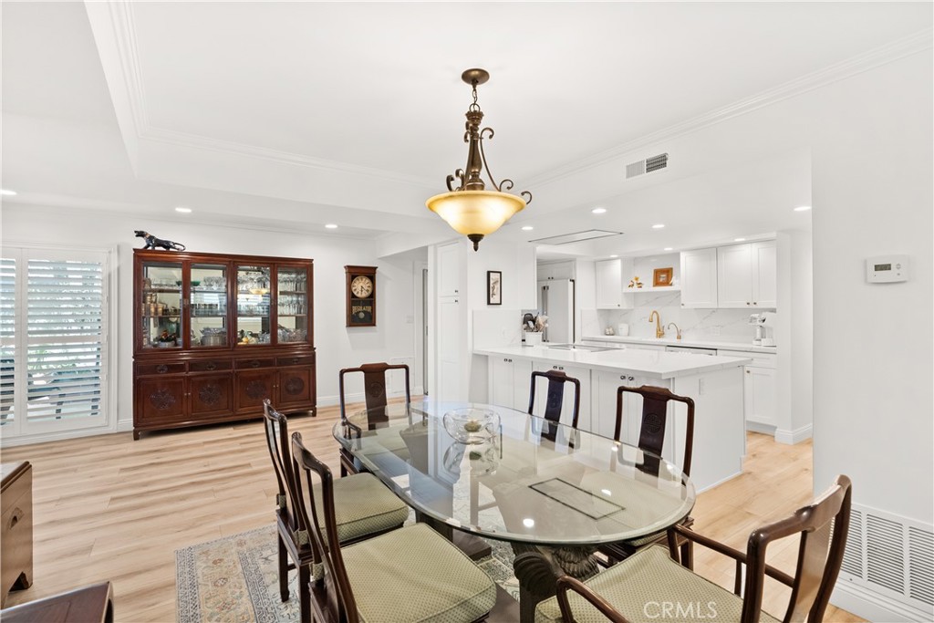 5 Canal Circle Newport Beach, CA 92663 - Photo 5 of 22 a view of a dining room with furniture window and wooden floor
