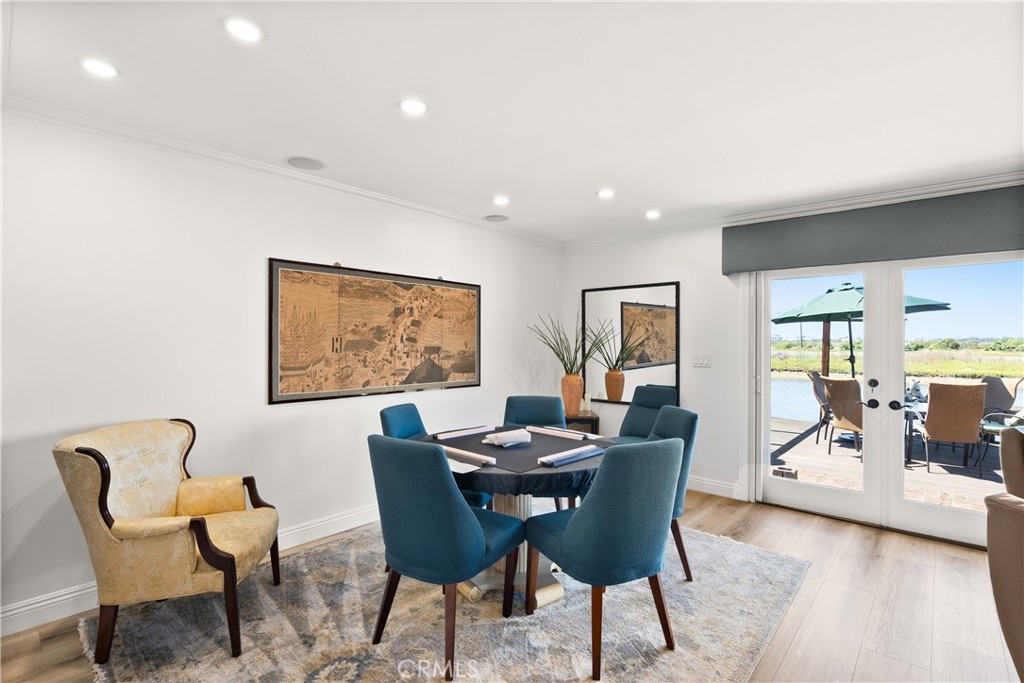 5 Canal Circle Newport Beach, CA 92663 - Photo 6 of 22 a dining room with furniture and wooden floor