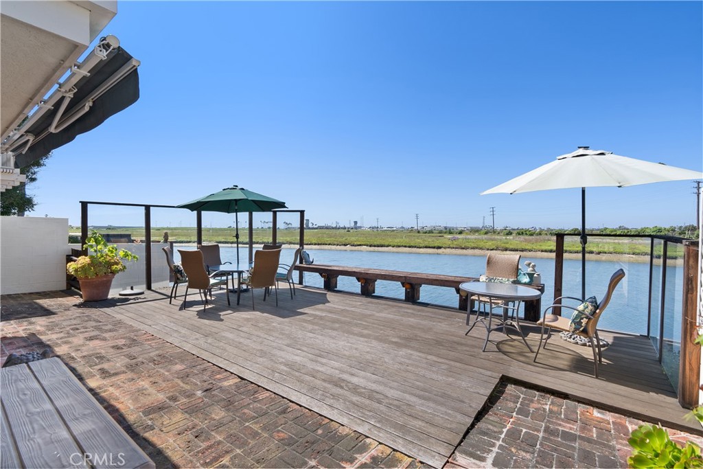 5 Canal Circle Newport Beach, CA 92663 - Photo 9 of 22 a view of a terrace with furniture and umbrella