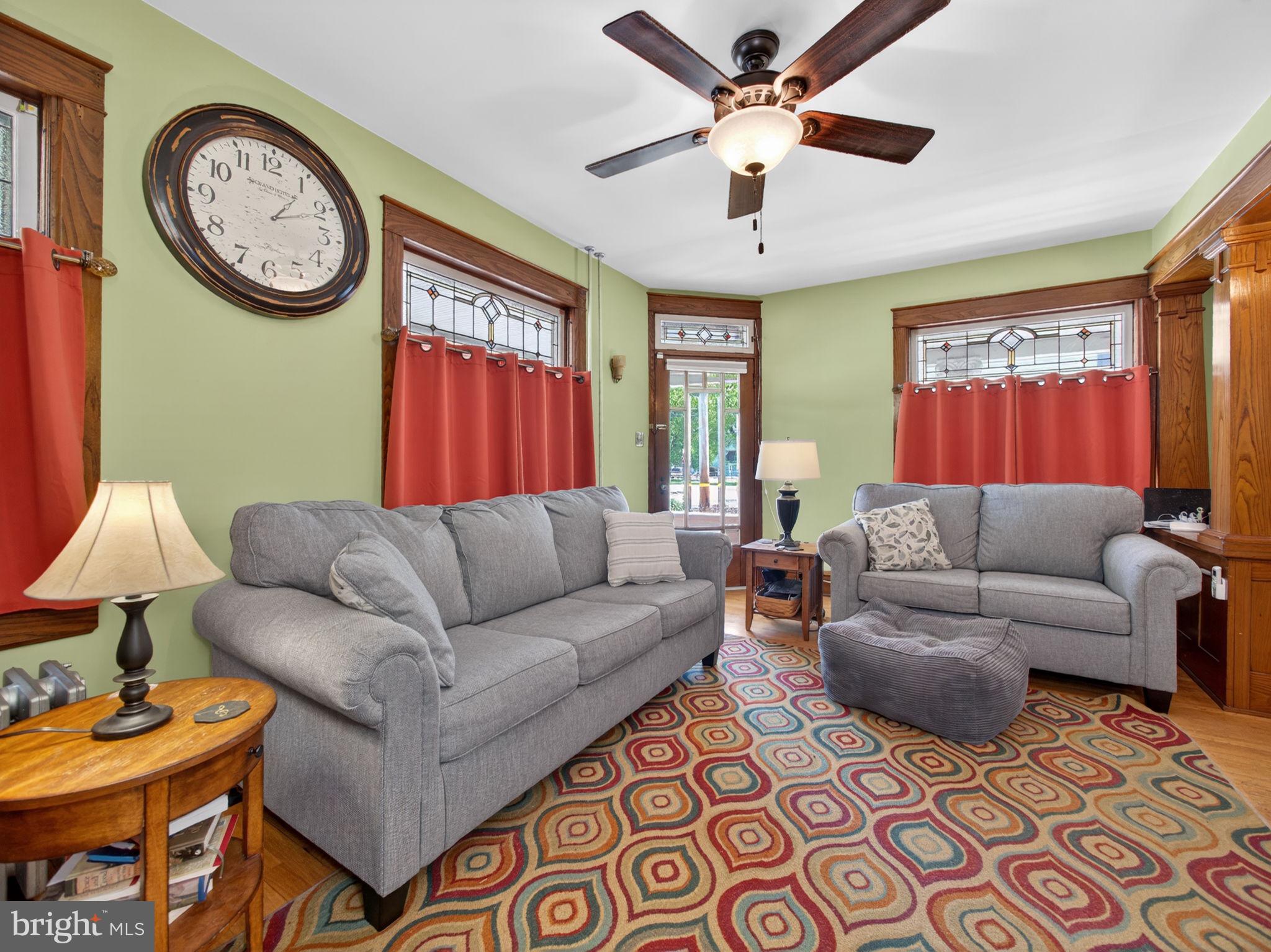6220 Bake Oven Road Germansville, PA 18053 - Photo 18 of 59 a living room with furniture a clock on wall and a window