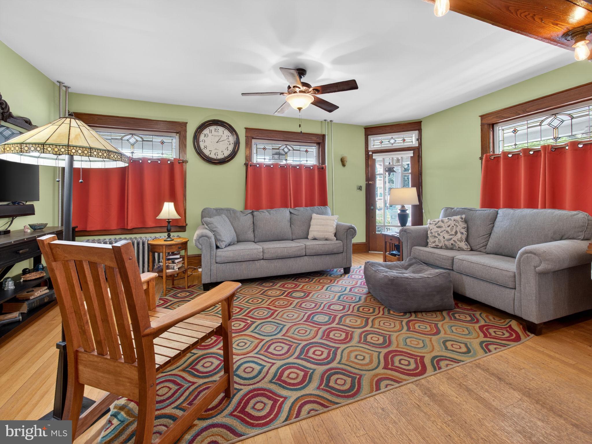 6220 Bake Oven Road Germansville, PA 18053 - Photo 19 of 59 a living room with furniture a clock on wall and a window