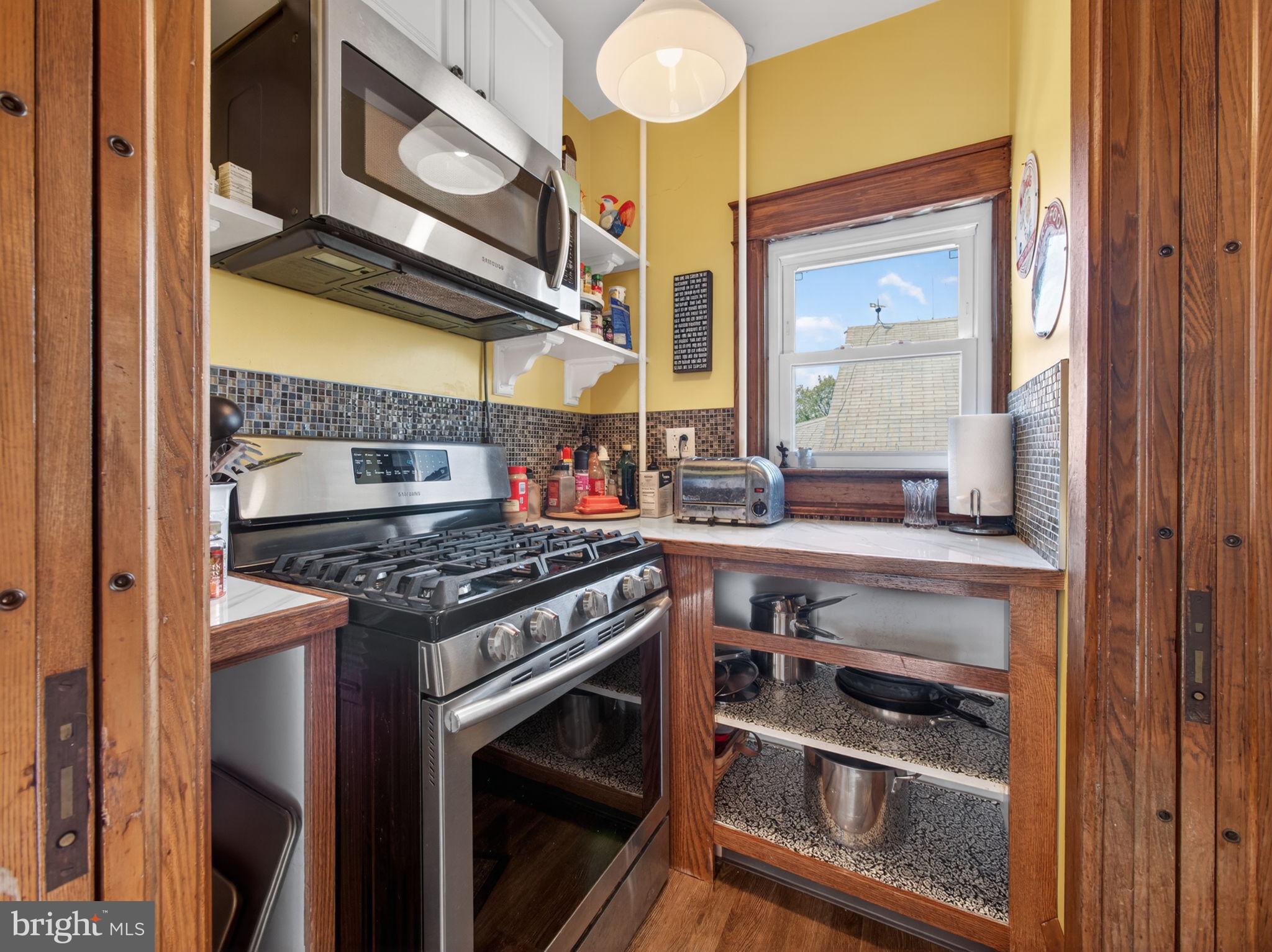 6220 Bake Oven Road Germansville, PA 18053 - Photo 31 of 59 a kitchen with stainless steel appliances granite countertop a stove and a microwave
