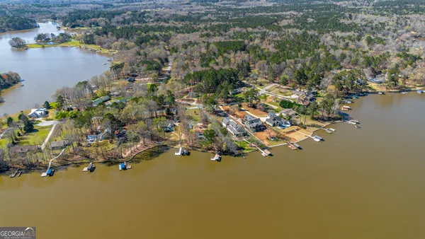 an aerial view of a houses with yard