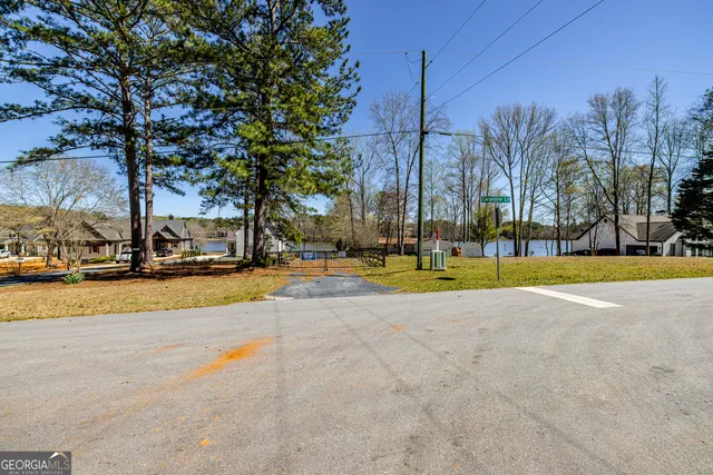 a view of swimming pool with palm trees