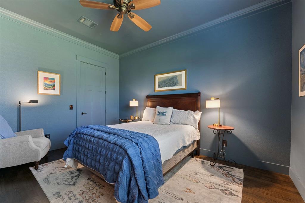 7430 Dawn Avenue Pilot Point, TX 76258 - Photo 19 of 39 a bedroom with a bed and wooden floor
