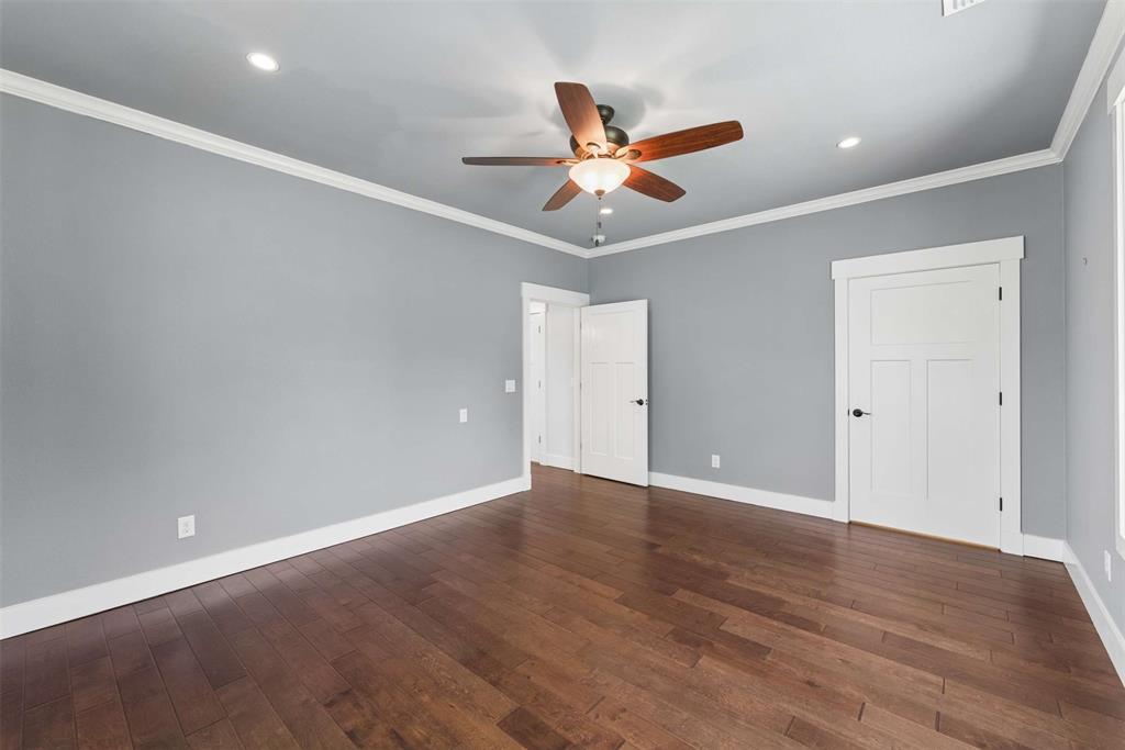 7430 Dawn Avenue Pilot Point, TX 76258 - Photo 28 of 39 an empty room with wooden floor closet and ceiling fan