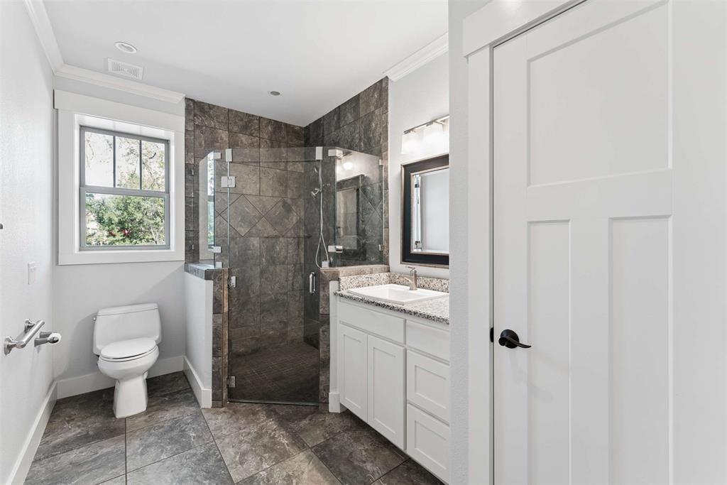 7430 Dawn Avenue Pilot Point, TX 76258 - Photo 30 of 39 a bathroom with a toilet sink and shower