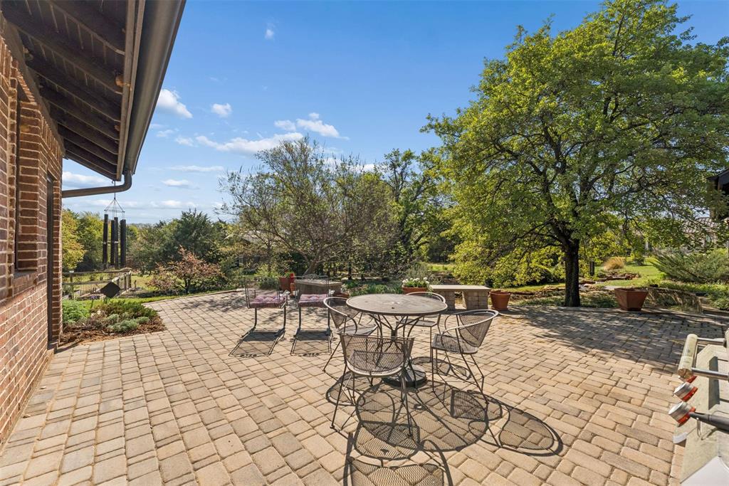 7430 Dawn Avenue Pilot Point, TX 76258 - Photo 33 of 39 a view of a tables and chairs on the patio